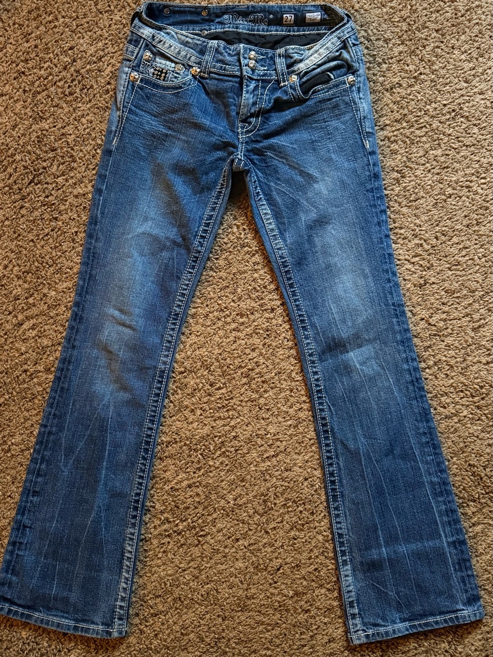 Y2K Vintage Miss Me low rise bootcut jeans with studded back pockets, size 27